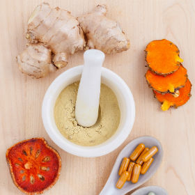mortar and pestle turmeric ginger powder herbal capsules and supplements, naturopathic services singapore